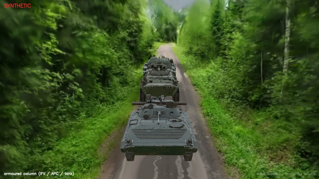Synthetic frame: an armoured column on a forest road, rendered into a 3D reconstruction of a real site.